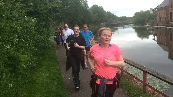 running in workplace group along canal